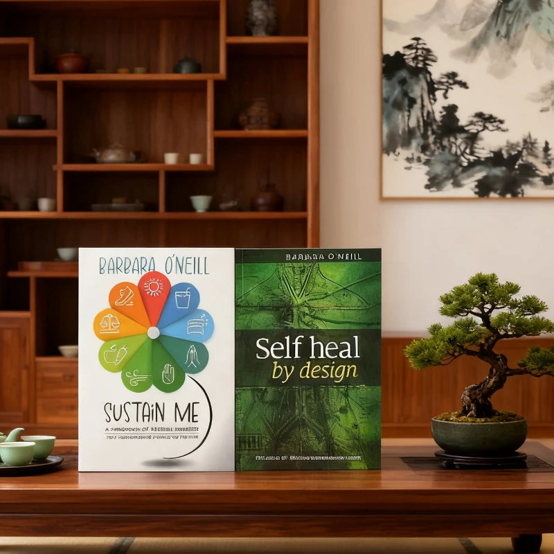 Two books on a wooden surface with a decorative shelf and artwork in the background