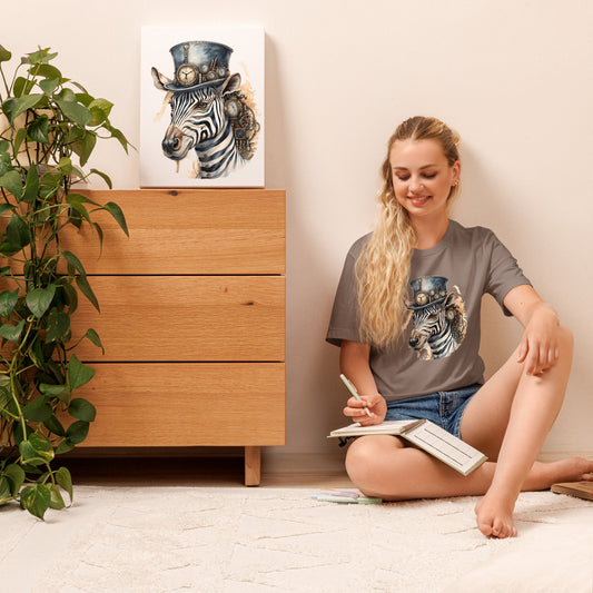 Woman sitting on the floor with a book, wearing a t-shirt with a zebra design, in a room with a wooden dresser and plant.