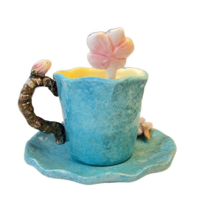 Decorative blue teacup with flowers on a white background