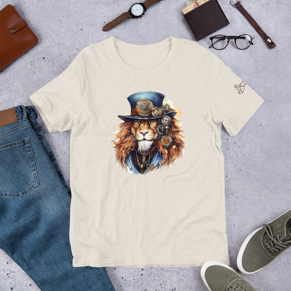 Beige t-shirt with a lion wearing a top hat design, surrounded by jeans, shoes, and accessories on a gray surface.