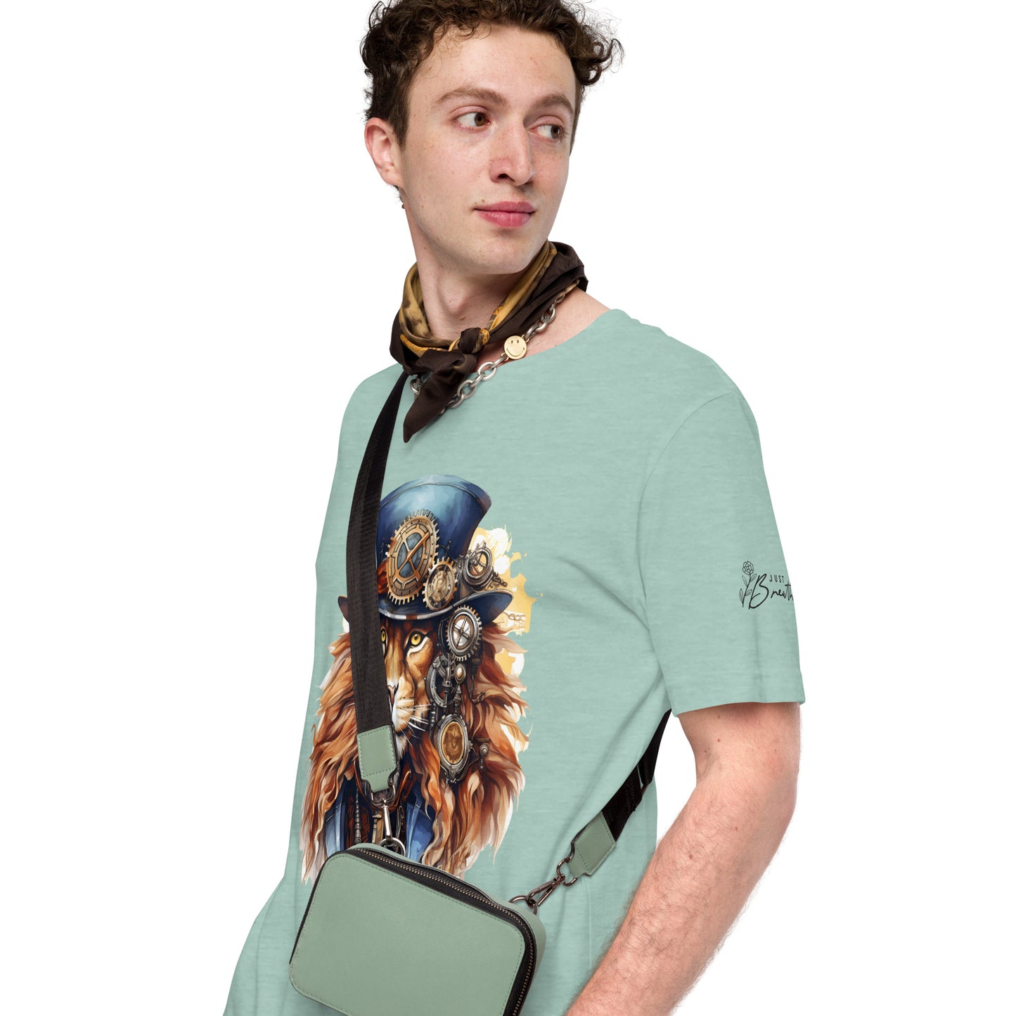 Man wearing a light green t-shirt with a graphic design of a steampunk lion and a matching bag.