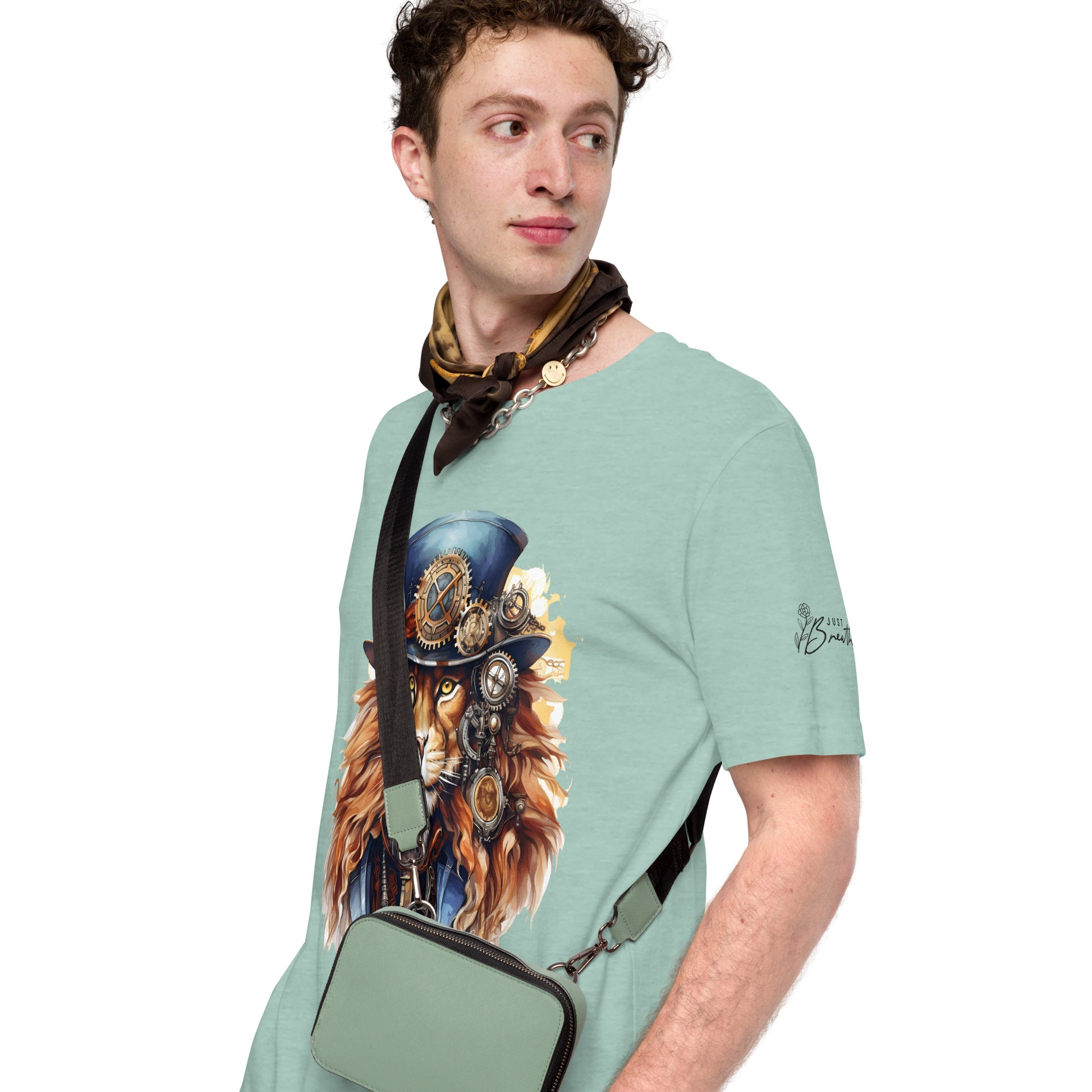 Man wearing a light green t-shirt with a graphic design of a steampunk lion and a matching bag.