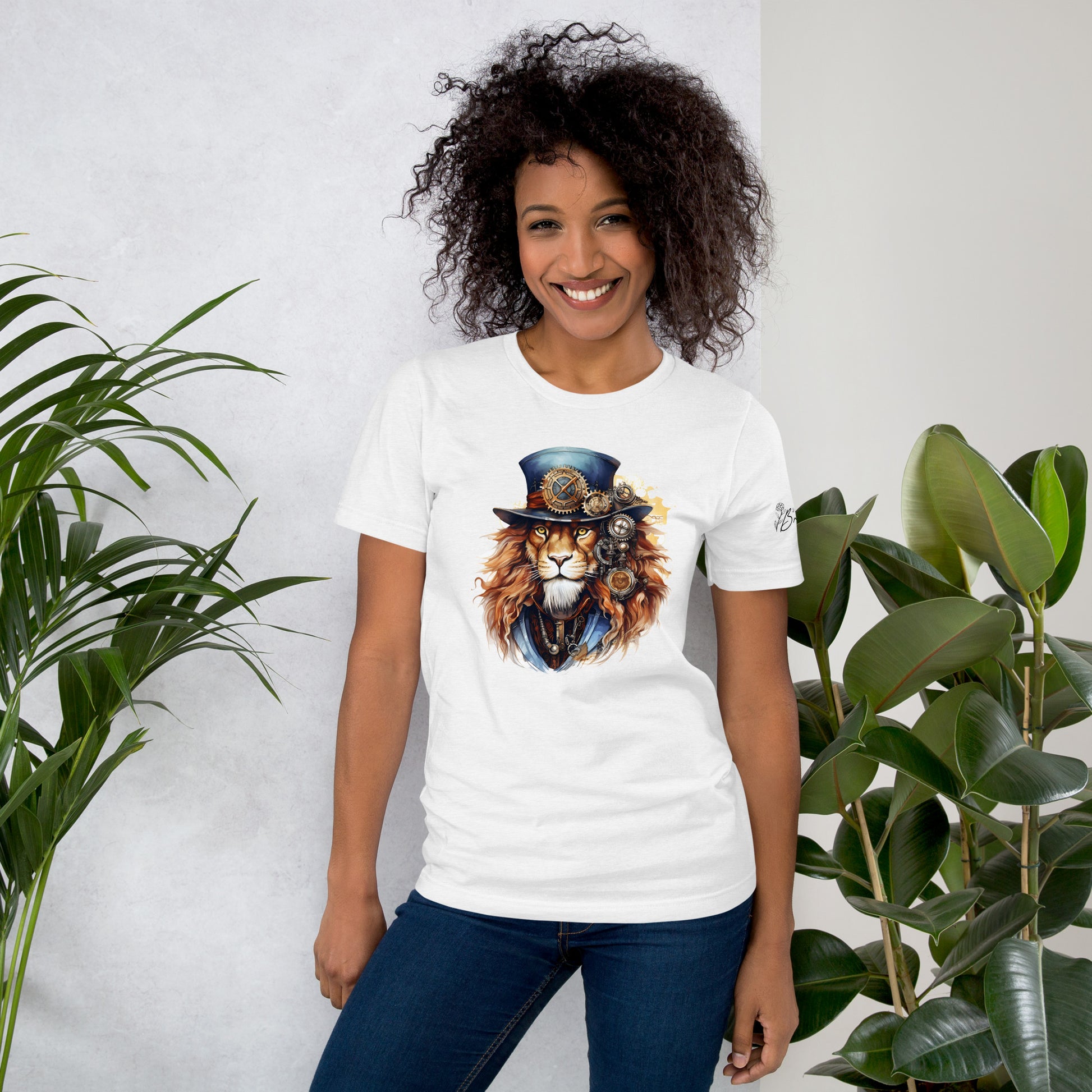 Person wearing a white t-shirt with a lion graphic design, standing between two plants against a light background